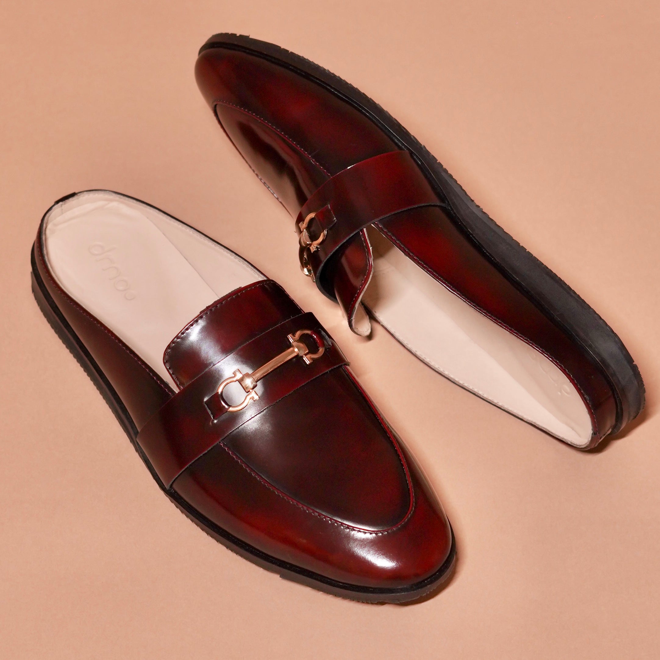 Detail shot of golden horsebit buckle on Hoffler Borgogno